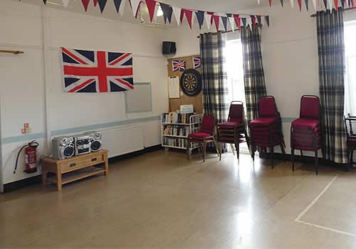 Photo Gallery Image - Book corner and dart board in the hall